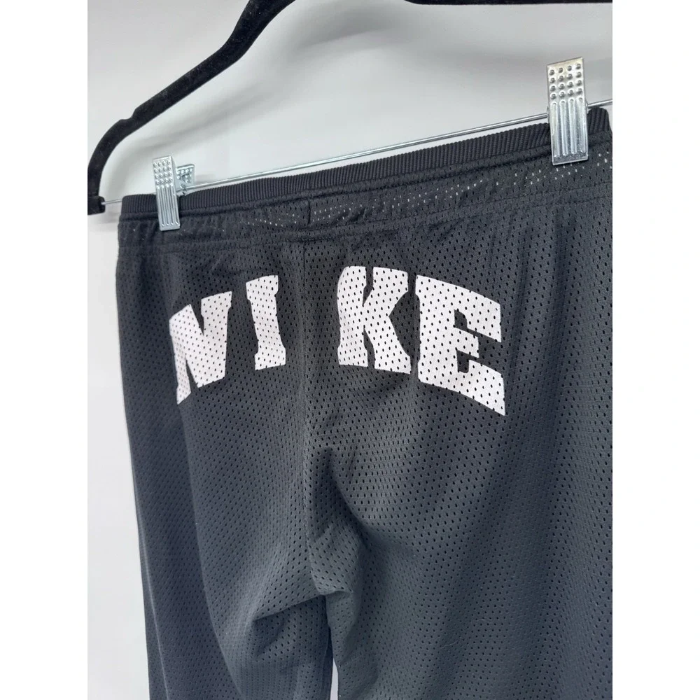 Nike girl M mesh lined snap side back logo flare pants athletic Y2K 90s preppy